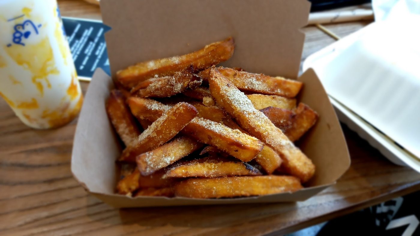 Crispy snack fries in a takeaway tray