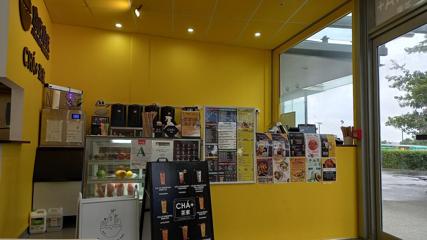 Bright CHÁ+ counter and menu wall