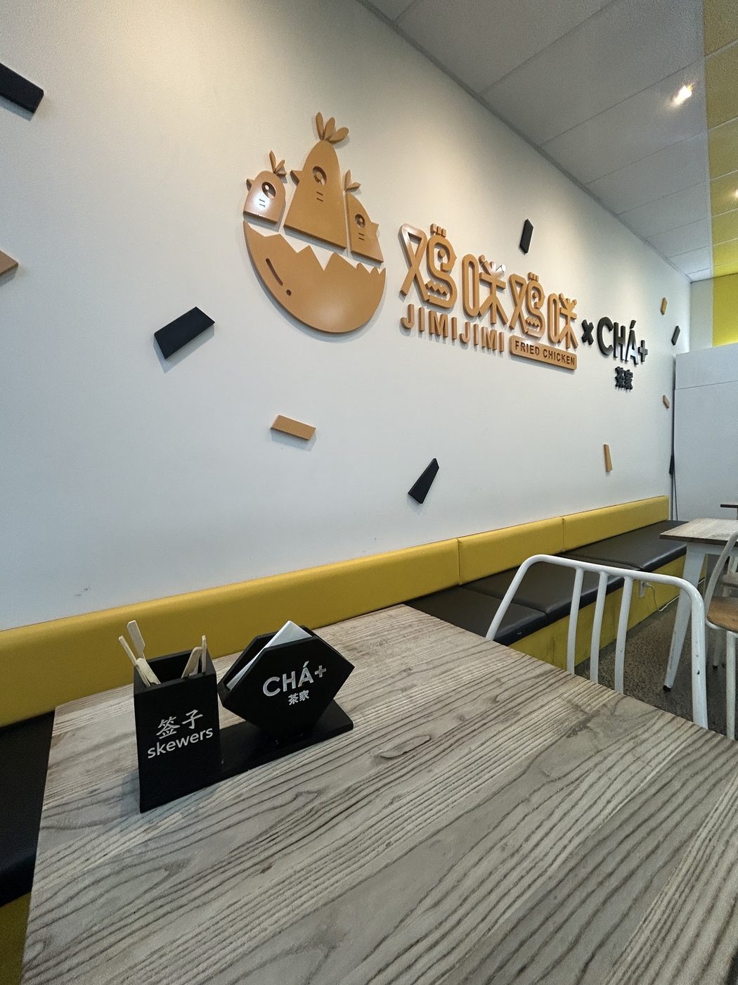 CHÁ+ wall and seating area